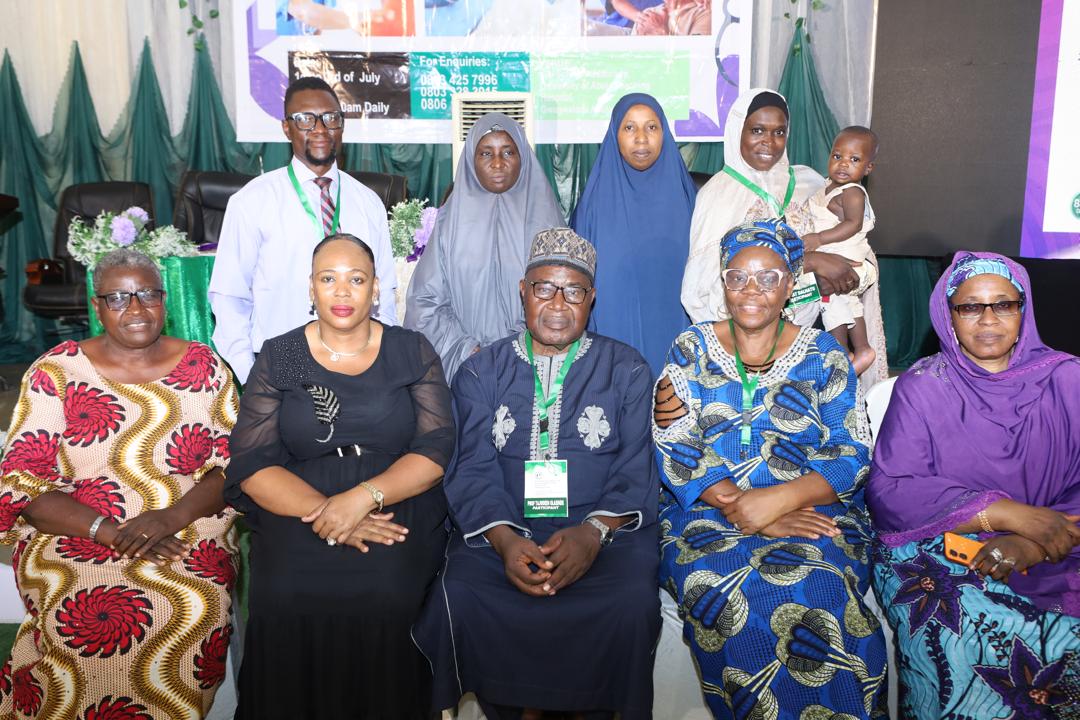 Committee members and family posed on stage