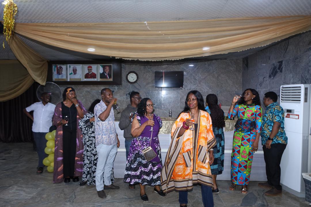 Guests gathered under the reception drapery