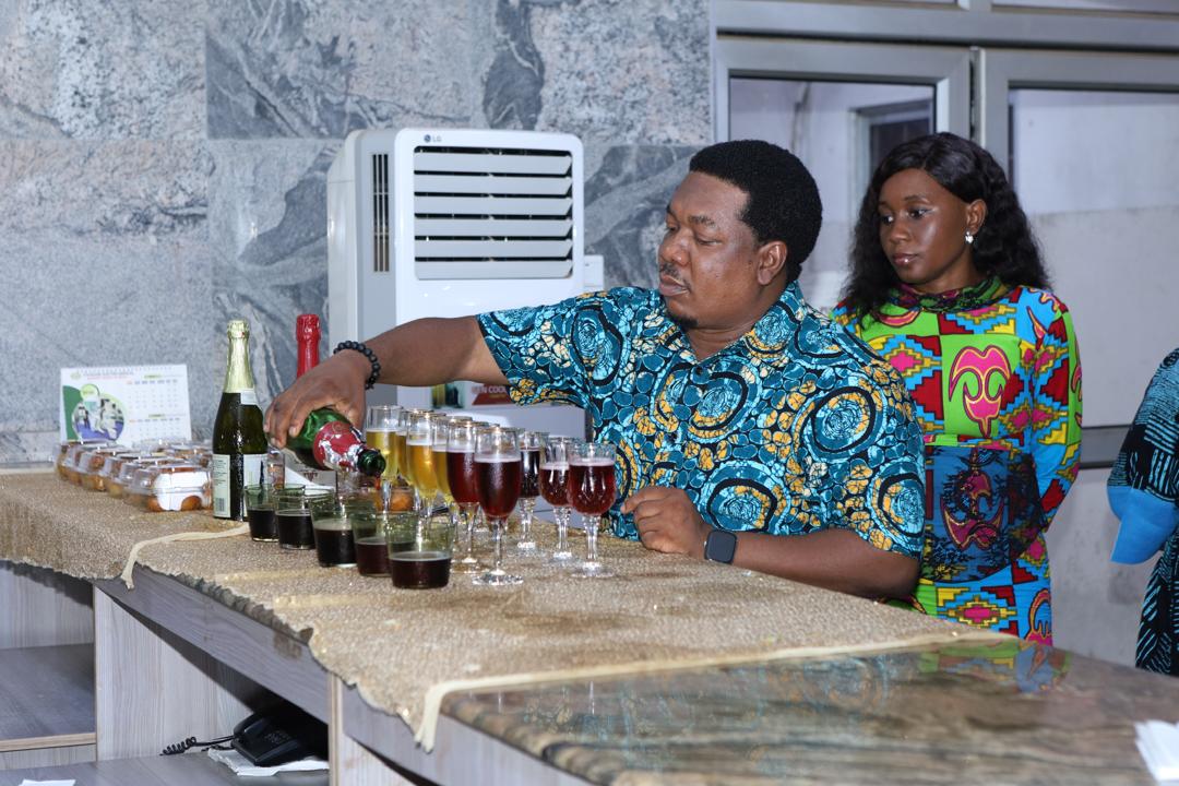 A row of drinks being poured at the reception bar